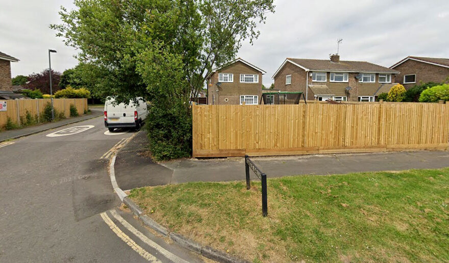 Photo of a wooden fence on the boundary of a residential property.